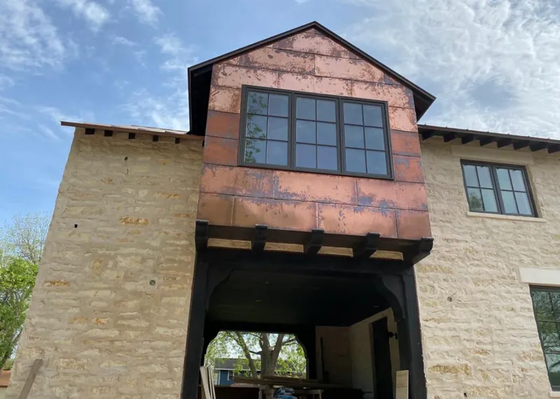 Copper metal panel facade on a stone building for Skylight Installation in Marlton